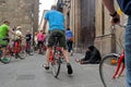 Barcelona, Spain - May 17, 2014: Beggar dressed in black sitting in the street of the Gothic Quarter.