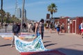 BARCELONA, SPAIN - MAY 15, 2017: Illegal sale of beach blankets and textiles near a city beach in Barcelona