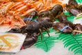 BARCELONA, SPAIN - MAY 16, 2017: Sale of the european lobsters and shrimps on the famous La Boqueria market in Barcelona