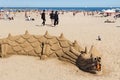 BARCELONA, SPAIN - MAY 15, 2017: Sand sculpture in the shape of a dragon on the beach in Barcelona Royalty Free Stock Photo