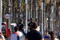 Barcelona, Spain, 03 May 2020: Two police officers on horses on the Barcelona beach promenade watching people walking and doing