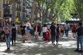 BARCELONA, SPAIN - MAY 15, 2017: Unknown people walking on the famous La Rambla street in center of Barcelona