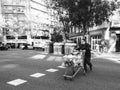 Male silhouette pushing a supermarket car at street intersection