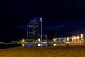 Barcelona, Spain - Nov 15, 2019: View of Barceloneta beach and the iconic sail shaped luxury Hotel Vela or W Royalty Free Stock Photo