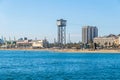 Beach Platja de St.Sebastia with the aerial tramway tower Torre Sant Sebastia in Barcelona, Spain
