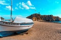 Barcelona, Spain-October 12, 2022. Costa Brava beach, fishing boats and Sa Palomera rock in the village of Blanes, Spain Royalty Free Stock Photo