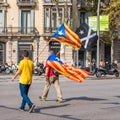 BARCELONA, SPAIN - OCTOBER 3, 2017: Demonstrators bearing catalan flag during protests for independence in Barcelona.