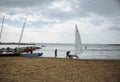 BARCELONA, SPAIN - OCTOBER 15, 2018: Man is going to windsurfing at the Barceloneta beach. Spanish vacation in Barcelona