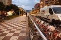 BARCELONA, SPAIN - OCTOBER 15, 2018: Modern Spanish streets in Barcelona. City life at night with bicycles parking