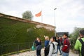 BARCELONA, SPAIN - OCTOBER 15, 2018: People looking at the Barcelona Montjuic castle. Tourists enjoying the view. Walls in ivy.