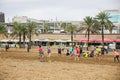 BARCELONA, SPAIN - OCTOBER 15, 2018: People are playing volleyball at the Barceloneta beach. Spanish vacation in Barcelona