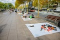 BARCELONA, SPAIN - OCTOBER 15, 2018: People selling illegal things in the Barcelona streets. Forgery on the ground