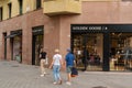 Barcelona, Spain. October 10, 2022: Tourists passing the window display outside a Golden Goose store in Passeig de
