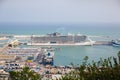 BARCELONA, SPAIN - OCTOBER 15, 2018: View on Barcelona port from Montjuic castle. Harbour with ships in the city. Cruise liner on
