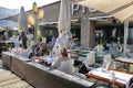 Barcelona Spain seafront perspective view of bar and restaurant terraces with tourists dining