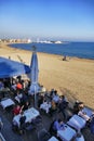 Barcelona Spain seafront perspective view of bar and restaurant terraces with tourists dining