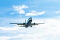 White and blue Ryanair aircraft with landing gear ready to land at Barcelona airport in Spain Royalty Free Stock Photo