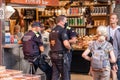 Barcelona, Spain - September 21, 2021: Barcelona Municipal Police, Guardia Urbana, and private security agent taking a rest