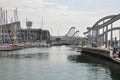 BARCELONA, SPAIN - SEPTEMBER 2016: People having rest, dining and watching cruise yachts. Aquarium Barcelona and funicular. Couple