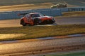 Cars at sunrise on track during 24h Series