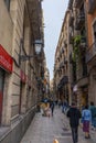 Barcelona, Spain - September 23, 2021: View into the narrow streets of the city. Beside the big boulevards narrow alleys