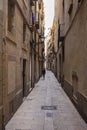 Barcelona, Spain - September 23, 2021: View into the narrow streets of the city. Beside the big boulevards narrow alleys