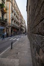 Barcelona, Spain - September 23, 2021: View into the narrow streets of the city. Beside the big boulevards narrow alleys