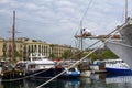 Barcelona marina with a man on bowsprit Royalty Free Stock Photo