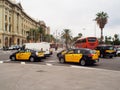 Barcelona tipical taxis at Columbus monument runabout Royalty Free Stock Photo