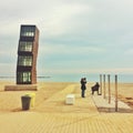 Barceloneta, Barcelona, February 2017: people observe beach