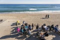 Barceloneta beach, a group of people playing cards on an autumn morning, Barcelona. Royalty Free Stock Photo