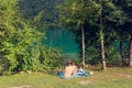 Barcis, Pordenone, Italy - August 12, 2018: people relax on the picturesque lakeside