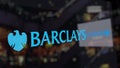 Barclays logo on the glass against blurred business center. Editorial 3D rendering