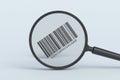 Barcode behind magnifying glass. Royalty Free Stock Photo