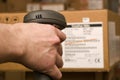 Barcode scaner is in the hands of man Royalty Free Stock Photo