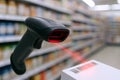 Barcode scanner in retail store with red laser beam focusing on product for efficient checkout process. concept of retail Royalty Free Stock Photo