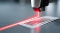 A barcode scanner scans a bar code on an item, emitting red light as it reads the information encoded in the pattern of bars and Royalty Free Stock Photo
