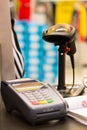 Barcode scanner on table with credit card machine