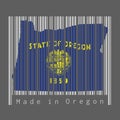 Barcode set the shape to Oregon map outline and the color of Oregon flag on grey barcode with dark grey background, text: Made in