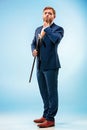 The barded man in a suit holding cane. Royalty Free Stock Photo