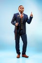 The barded man in a suit holding cane. Royalty Free Stock Photo