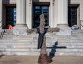 Bare Easter Cross with Three Homeless Men