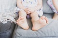 Bare feet of anonymous little girl resting on couch Royalty Free Stock Photo