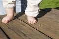 Bare feet of a baby doing his first steps Royalty Free Stock Photo