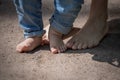 The little feet of a child walk barefoot on the sand Royalty Free Stock Photo