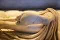 Bare feet of a carved marble statue in the museum there are many hard feet of ancient and historical style in greek art room