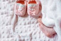 Bare feet of a cute newborn baby in warm white blanket. Childhood. Small bare feet of a little baby girl. Sleeping Royalty Free Stock Photo