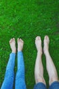 Bare feet and legs in grass Royalty Free Stock Photo