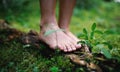 Bare feet of man standing barefoot outdoors in nature, grounding concept. Royalty Free Stock Photo