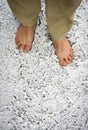 Bare feet on snowy grass